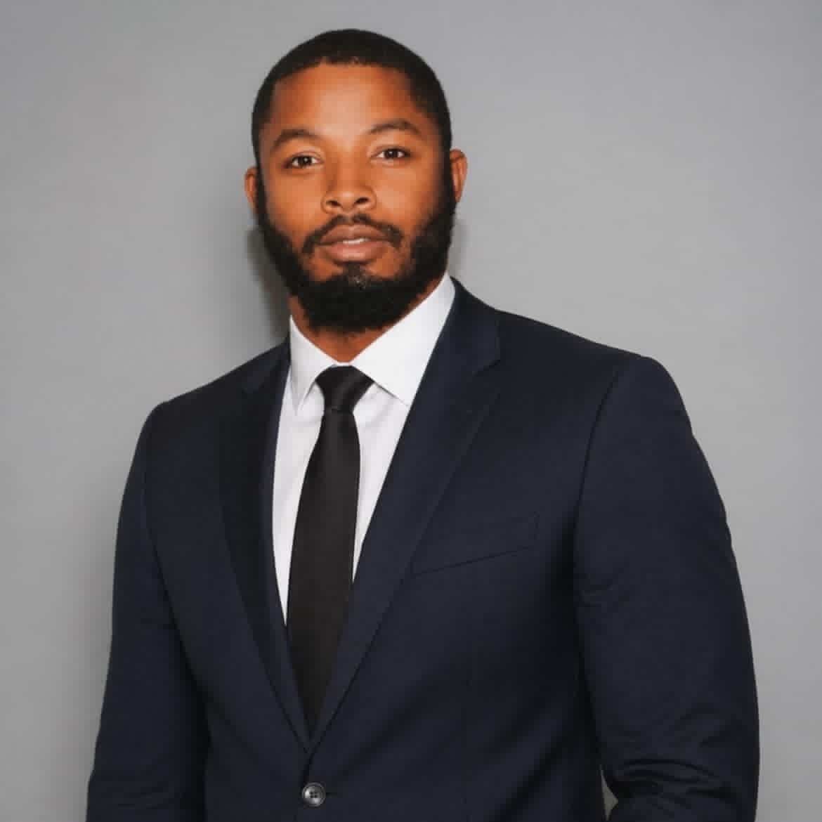 Frantz Duvernay, Commercial Real Estate Specialist at Axis Realty Advisors, Inc., in a navy suit