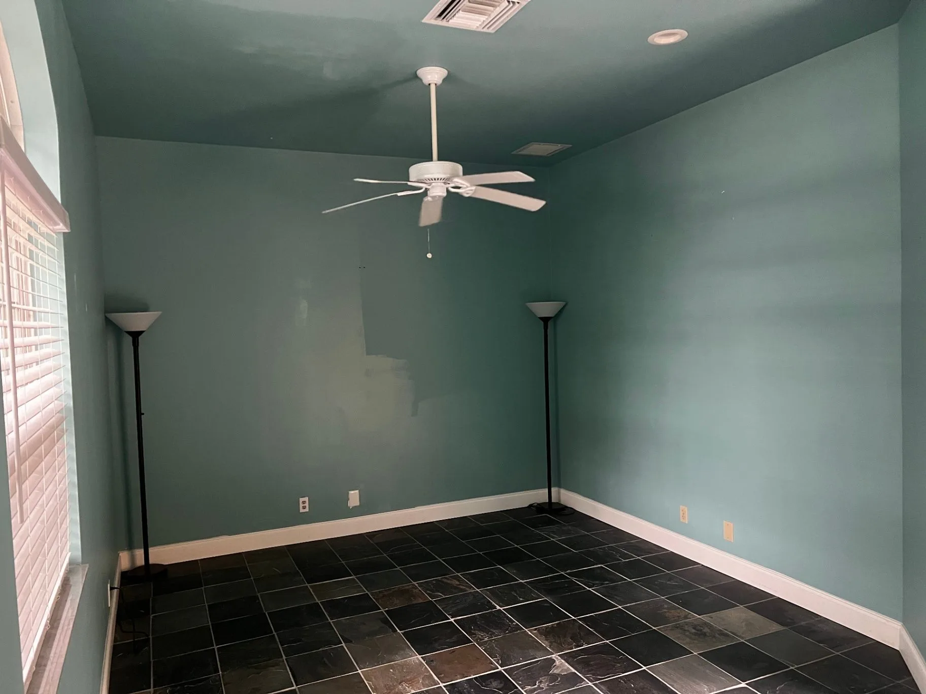 Unfurnished interior room at Magnolia 720 with slate-style flooring
